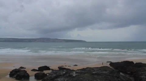 Man Walking Across Beach Real Time with Timelapse Sky Stock Footage 26560870