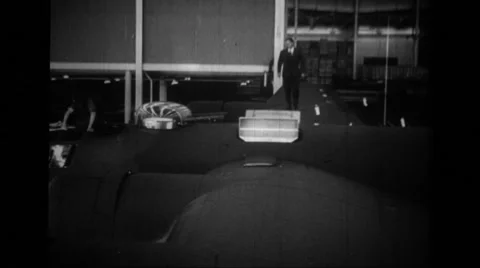 A man walking across wing and looking into interior of B-24 Liberator Stock Footage 39914529