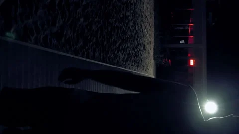 A man is walking alone in the dark on the streets Stock Footage 91187019