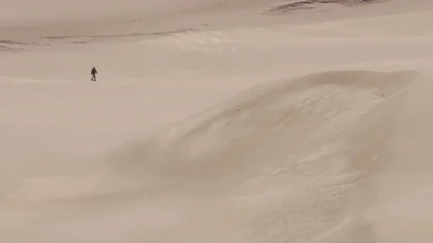 Man walking alone in desert. Great Sand Dunes National Park, Colorado, USA. Stock Footage