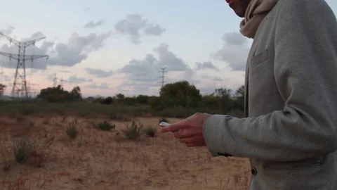 Man Walking Alone outside Texting On His Cellphone Stock Footage 75830214