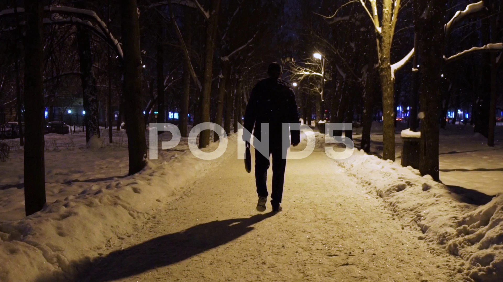 man walking alone at night