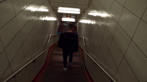 Man walking alone through a tunnel in the Chicago Underground. Stock-Footage 82549360