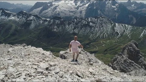 Man walking alone towards mountain Stock Video Pond5