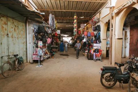 Man walking along a corridor inside Rissani bazaar in Morocco. Stock Photos