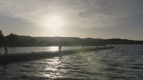 Man walking along the pier Stock Footage 108676389