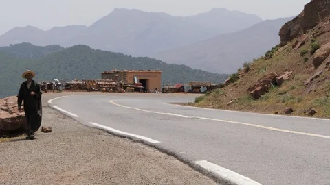 Man walking along the road in Morocco, Africa in 4K Stock Footage 91834505