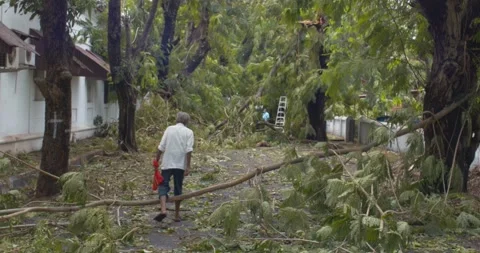 Man walking among the Cyclone  Destruction Stock Footage