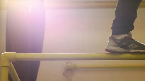 Man Walking and Balancing on the Bar Stock Footage 70535198