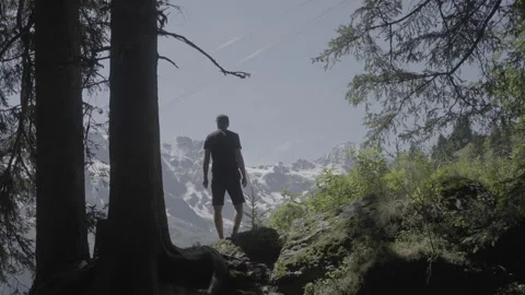 Man walking up and looking at a mountain cable car, nice view, slog3 Stock Footage 166631479