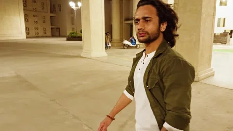 Man walking and talking at night Video stock 276776484