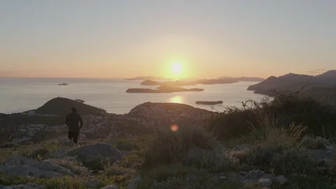 Man walking and watching sunset from Mount Srd, Dubrovnik, Croatia, 4k Video stock 274457246