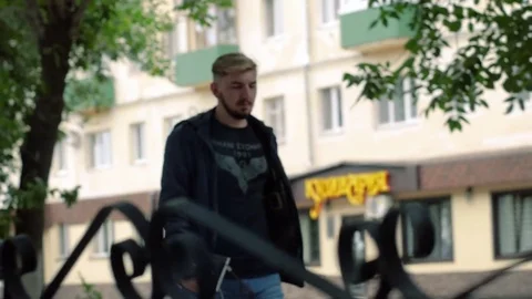 A man is walking around the city Stock Footage 84459153