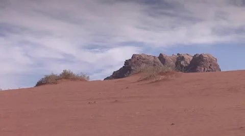 Man Walking Away in Desert, Wadi Rum, Jordan - wide Stock Footage 22024923