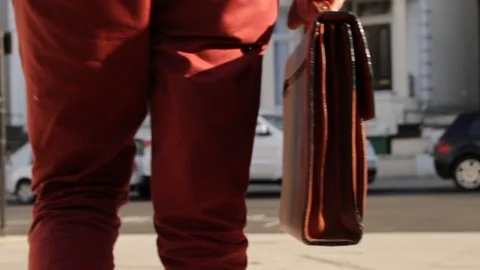 Man walking with a bag in his hand colorful 스톡 동영상 92267133
