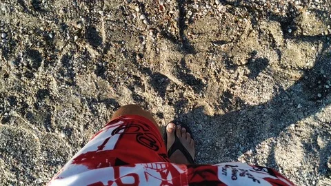 Man walking bare foot on sandy beach Stock Footage 112753709