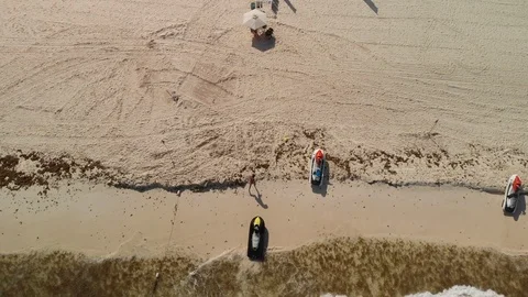 Man walking on the beach after jest ski. Stock Footage 123179098