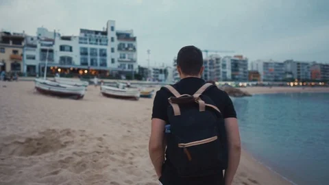 Man walking on beach alone in summer. Stock Footage 100123693