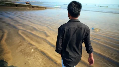 Man Walking on Beach Back View Video stock 281329744