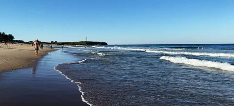 Man Walking on the beach with child Stock Footage 163941105