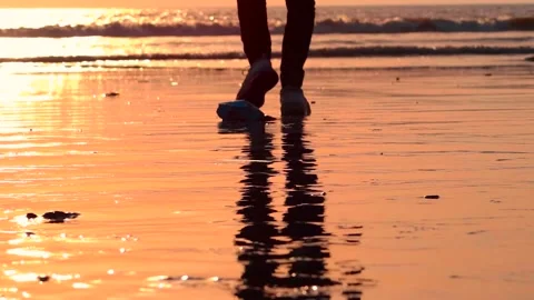 Man walking on the beach at the evening time Stock Footage 271718985