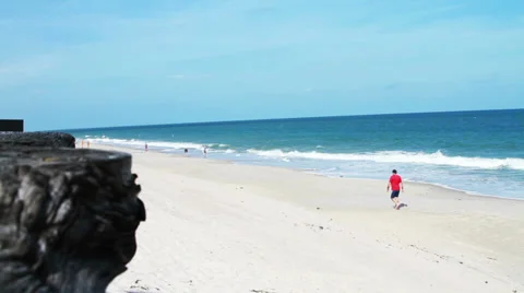 Man walking on Beach ` Stock Footage 34512253