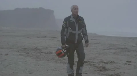 Man walking on beach Stock Footage 63465278