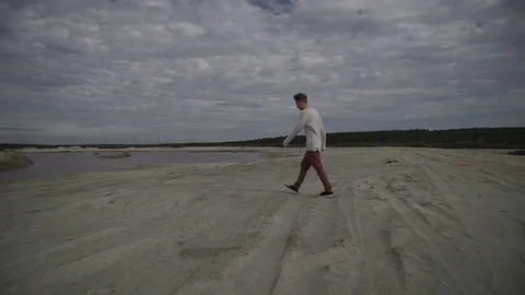 Man walking on beach Stock Footage