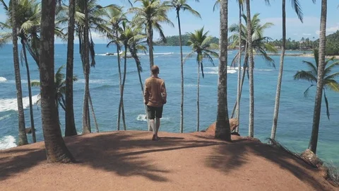 Man walking on the beach Stock Footage 109422292