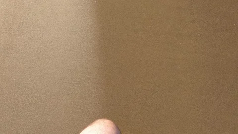 A man walking on the beach Stock Footage 161198119