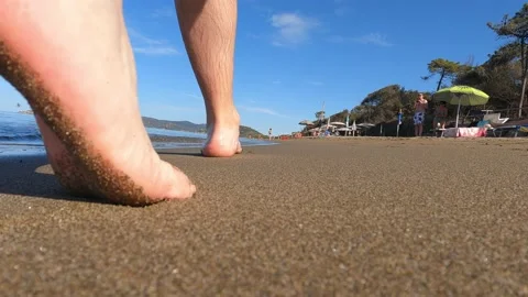 A man walking on the beach Stock Footage 161437973