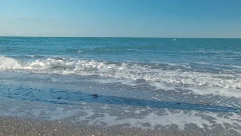 Man walking on the beach Stock Footage 168297214