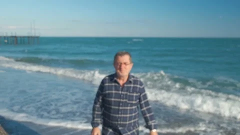 Man walking on the beach Stock Footage 168821139