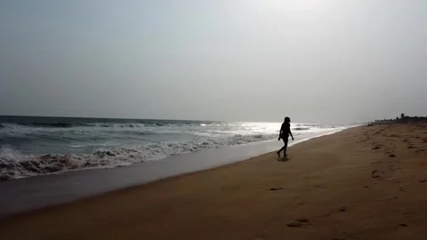 Man walking on the beach Stock Footage 245232543