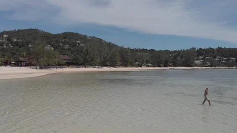 Man Walking on the Beach Stock Footage 260431169