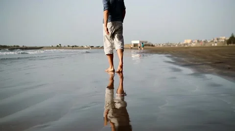 Man walking on the beach HD Stock-Footage 10869405