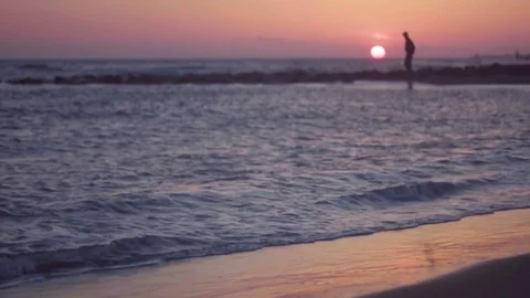 Man walking on the beach. Landscape of beautiful sunset beach, sand. Stock Footage 80438992