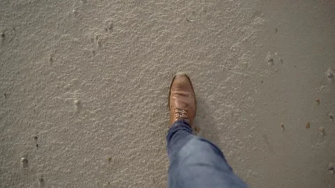 Man walking on beach with leather brown shoes Видео 261078950