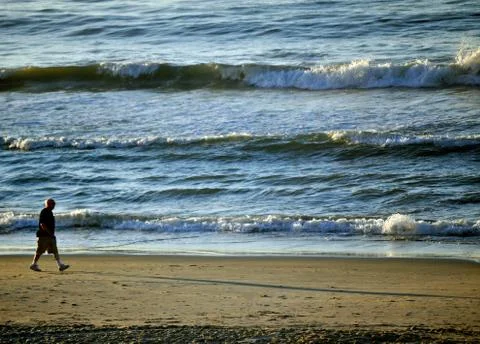 Man walking on beach 스톡 사진