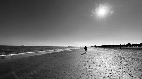 Man walking on the beach Stock Photos