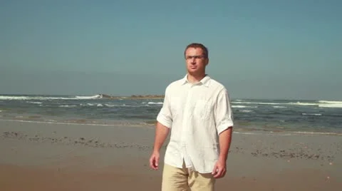 Man walking on the beach, steadicam shot 스톡 동영상 10892268