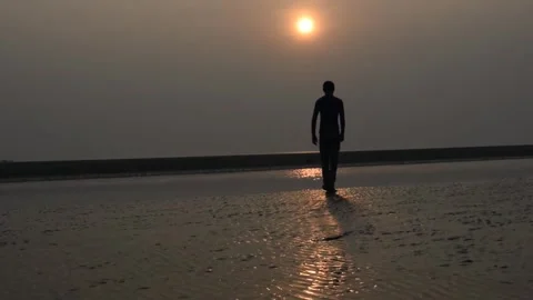 Man Walking on Beach at Sunset, Silhouette Animation Stock Footage 307909570