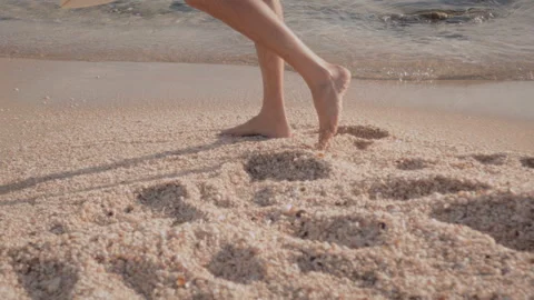 Man walking on the beach with a surfboard Stock Footage 275165991