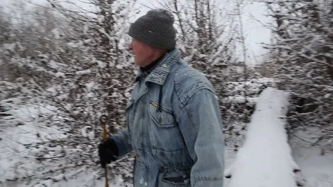Man walking in beautiful winter landscape Видео 70210262