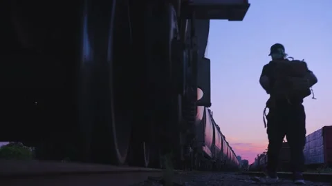 A man walking beside trains. Stock Footage 157996469