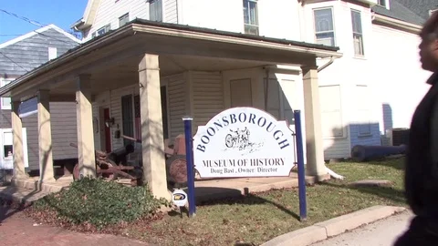 Man walking into Boonsborough Museum Stock Footage 79470617