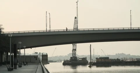 Man walking on the bridge in Dubai Stock Footage 118976644