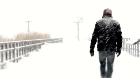  Man Walking on a Bridge During Snow Storm Stock Footage 162257124