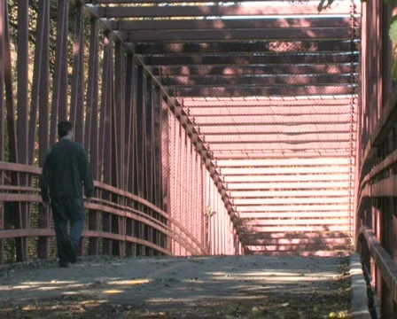 Man Walking on Bridge Stock Footage 284482