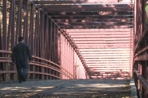 Man Walking on Bridge Stock Footage 285001